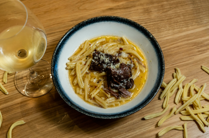 Syzouma (traditional pasta) with a glass of Malvazia di Candia P.G.I. Crete