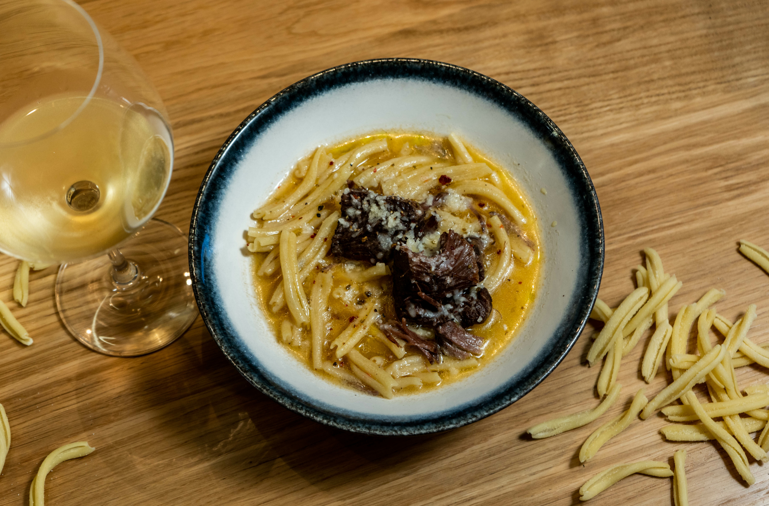 Syzouma (traditional pasta) with a glass of Malvazia di Candia P.G.I. Crete